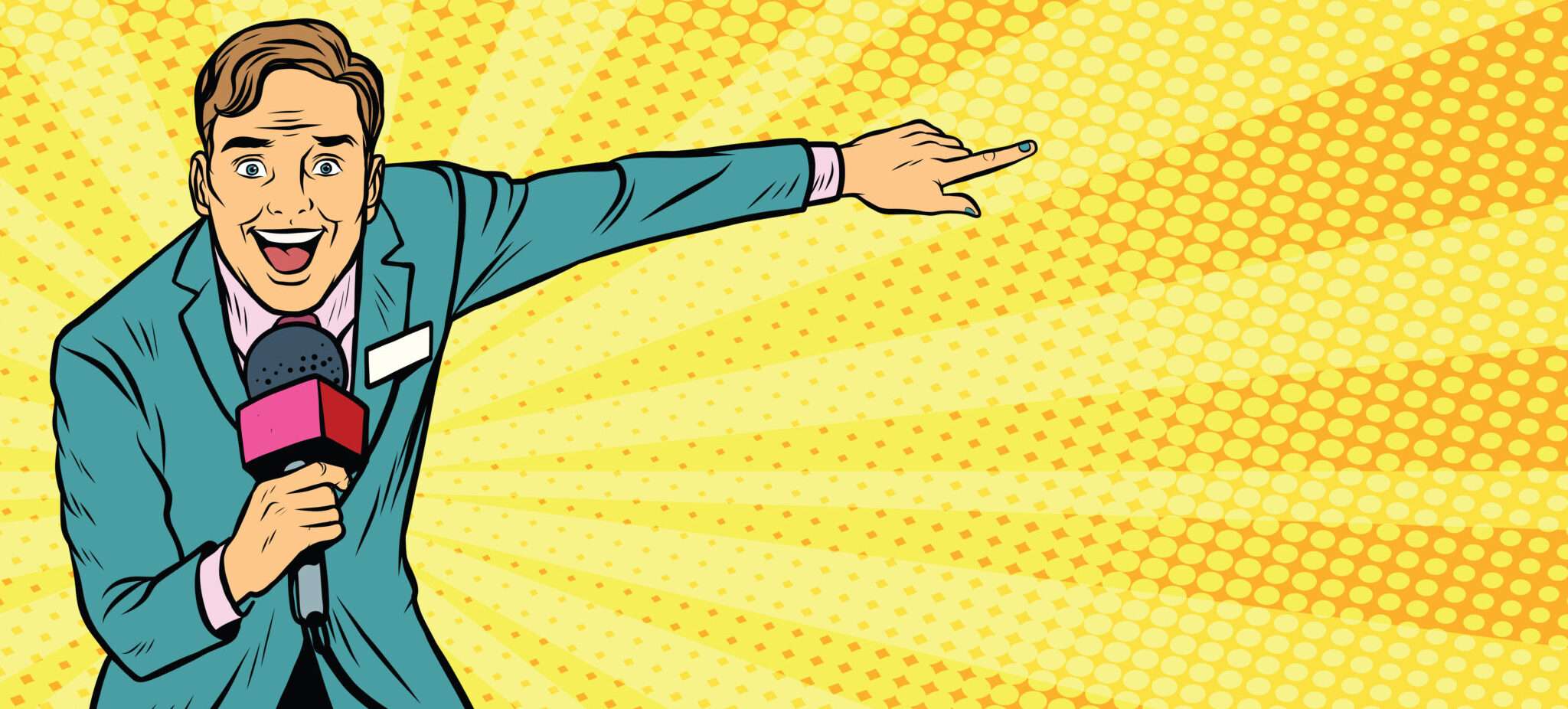 フランスでスーツを着た男性がマイクを持って何かを指差している。