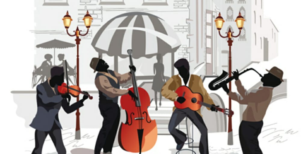 フランスの路上で音楽を演奏するミュージシャンのグループ。 フランスの路上で音楽を演奏するミュージシャンのグループ。