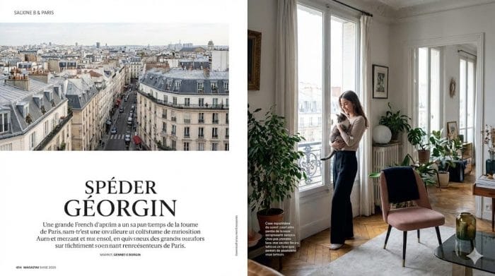 アパルトマンの窓辺で猫とくつろぐフランス人女性